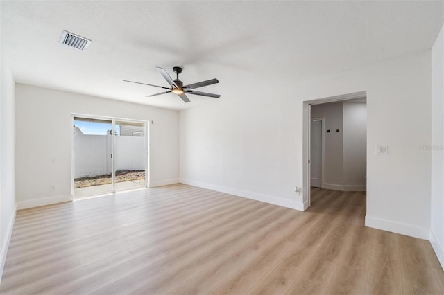 7607 22nd Ave W, Bradenton, FL 34209 - empty room featuring light wood finished floors, a ceiling fan, and baseboards
