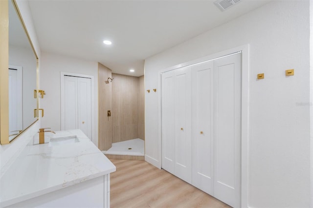 7607 22nd Ave W, Bradenton, FL 34209 - corridor featuring a sink, light wood-style flooring, and recessed lighting