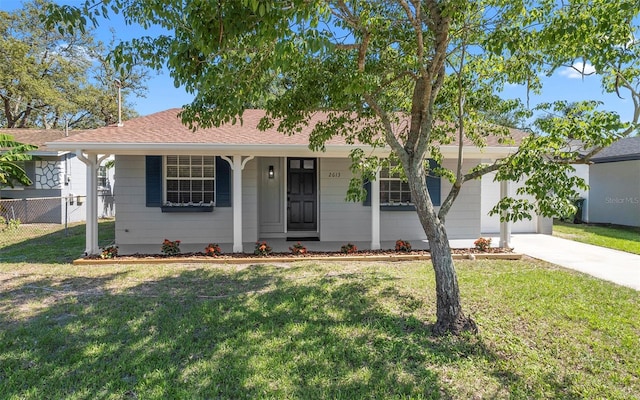 2613 E 113th Ave, Tampa, FL 33612 - single story home featuring concrete driveway, covered porch, and a shingled roof