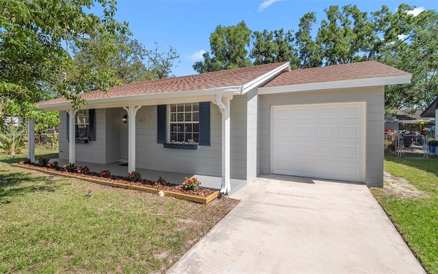 2613 E 113th Ave, Tampa, FL 33612 - single story home featuring an attached garage, concrete driveway, covered porch, and roof with shingles