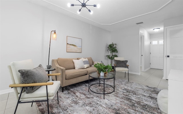 2613 E 113th Ave, Tampa, FL 33612 - tiled living area with a chandelier and baseboards