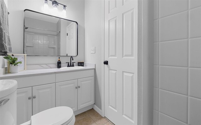 2613 E 113th Ave, Tampa, FL 33612 - full bath with vanity, tile patterned floors, toilet, and a shower
