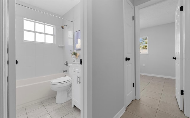 2613 E 113th Ave, Tampa, FL 33612 - bathroom featuring tile patterned flooring, tub / shower combination, toilet, and baseboards