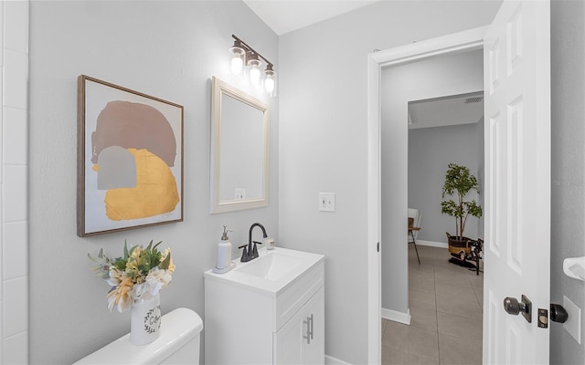 2613 E 113th Ave, Tampa, FL 33612 - bathroom featuring toilet, tile patterned floors, and vanity