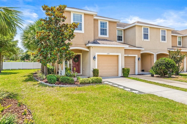 6974 Holly Heath Dr, Riverview, FL 33578 - view of property with an attached garage, concrete driveway, and stucco siding
