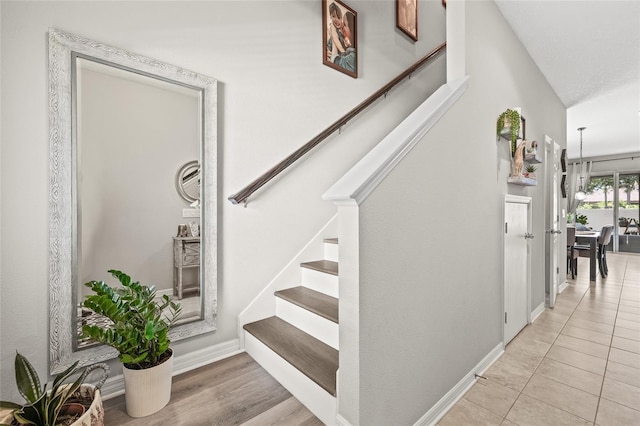 6974 Holly Heath Dr, Riverview, FL 33578 - stairs with baseboards and tile patterned flooring