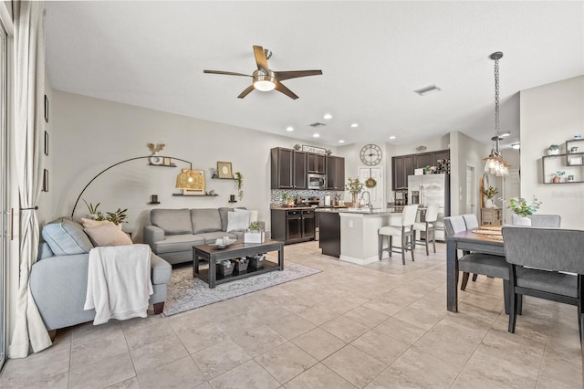 6974 Holly Heath Dr, Riverview, FL 33578 - living room featuring a ceiling fan, recessed lighting, and light tile patterned floors