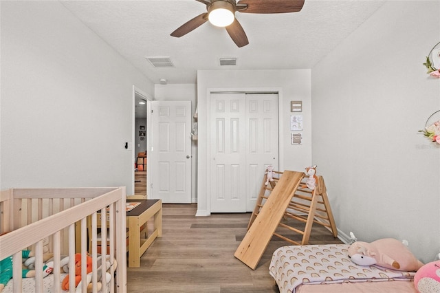6974 Holly Heath Dr, Riverview, FL 33578 - bedroom featuring wood finished floors, a closet, and a ceiling fan