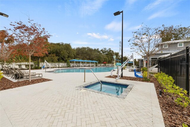 6974 Holly Heath Dr, Riverview, FL 33578 - community pool with a community hot tub and a patio area