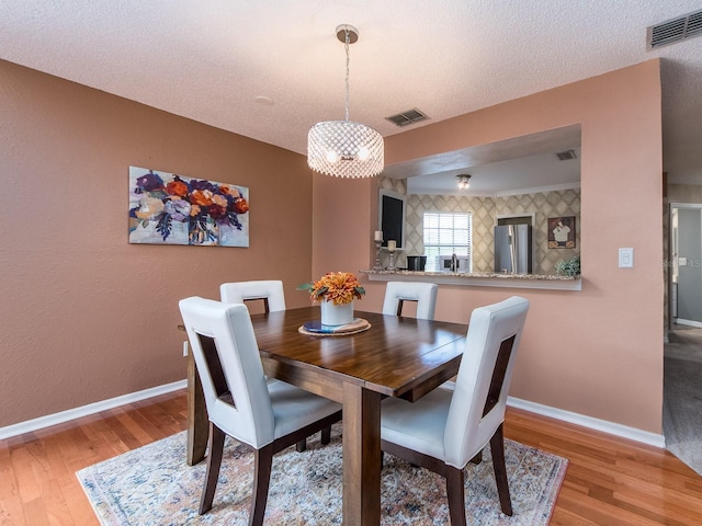 3455 Countryside Blvd Unit 101, Clearwater, FL 33761 - dining area with wood finished floors and baseboards