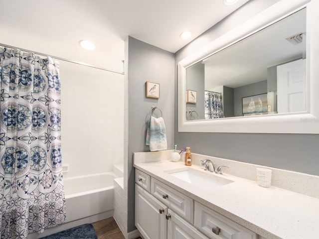 3455 Countryside Blvd Unit 101, Clearwater, FL 33761 - bathroom featuring vanity, shower / tub combo with curtain, and recessed lighting