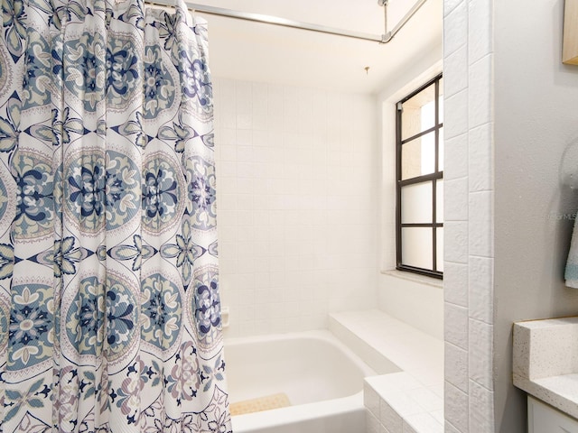3455 Countryside Blvd Unit 101, Clearwater, FL 33761 - bathroom with shower / tub combo with curtain and vanity