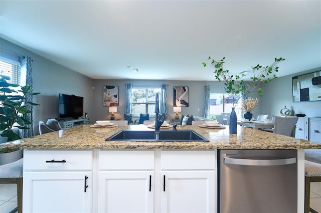 10826 Trailing Vine Dr, Tampa, FL 33610 - kitchen with open floor plan, stainless steel dishwasher, light tile patterned floors, and light stone countertops