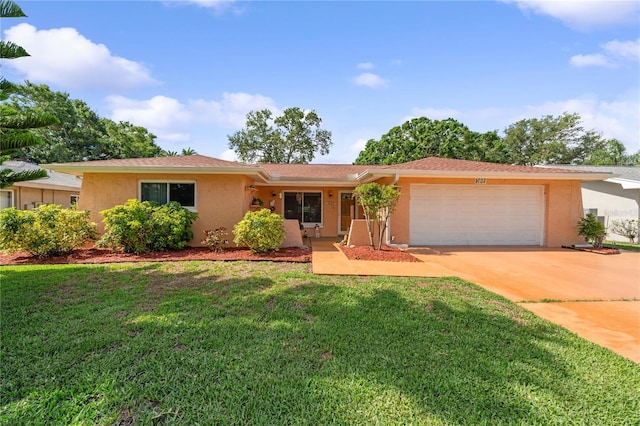 1707 Hibiscus Cir S, Oldsmar, FL 34677 - ranch-style house with an attached garage, stucco siding, concrete driveway, and a front lawn
