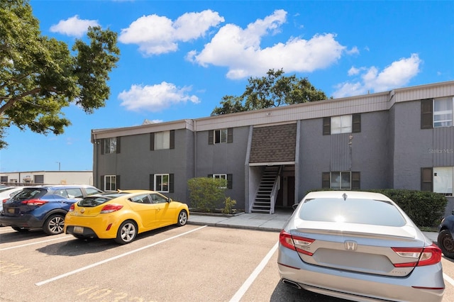 4032 Cortez Dr Unit A, Tampa, FL 33614 - view of property with uncovered parking and stairway