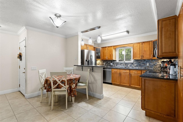 4032 Cortez Dr Unit A, Tampa, FL 33614 - kitchen with appliances with stainless steel finishes, brown cabinetry, a textured ceiling, tasteful backsplash, and ornamental molding