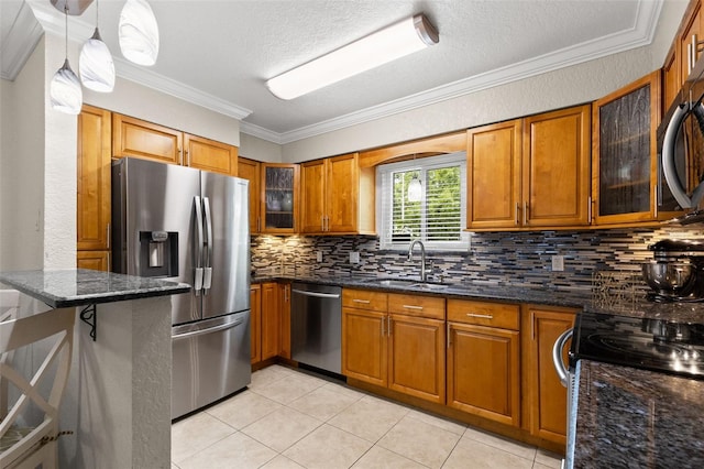 4032 Cortez Dr Unit A, Tampa, FL 33614 - kitchen with appliances with stainless steel finishes, brown cabinetry, a sink, tasteful backsplash, and crown molding