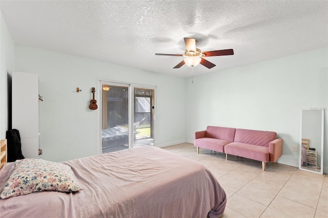 4032 Cortez Dr Unit A, Tampa, FL 33614 - bedroom featuring light tile patterned floors, access to outside, baseboards, ceiling fan, and a textured ceiling