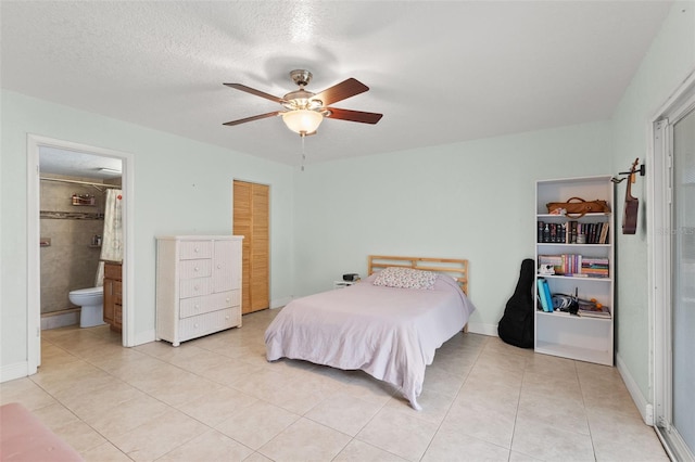 4032 Cortez Dr Unit A, Tampa, FL 33614 - bedroom with light tile patterned floors, a closet, ensuite bath, and a ceiling fan
