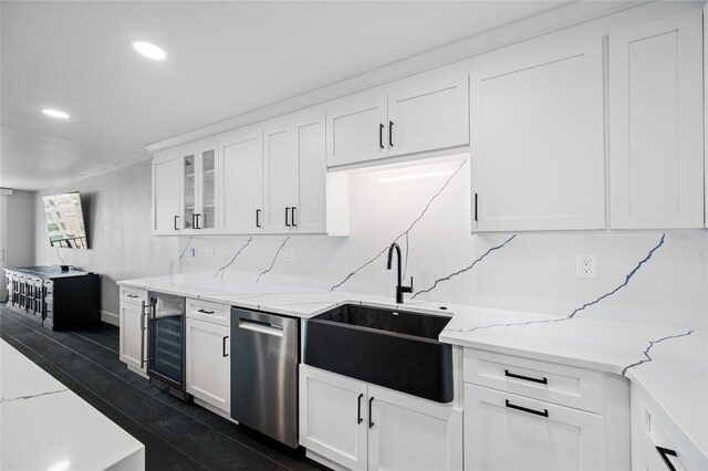 100 Oakmont Ln Unit 802, Belleair, FL 33756 - kitchen with dishwasher, a sink, wine cooler, tasteful backsplash, and white cabinetry
