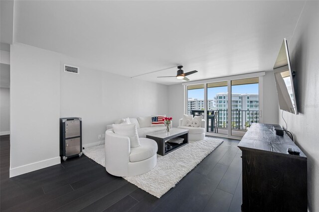100 Oakmont Ln Unit 802, Belleair, FL 33756 - living area with dark wood finished floors, a ceiling fan, and baseboards