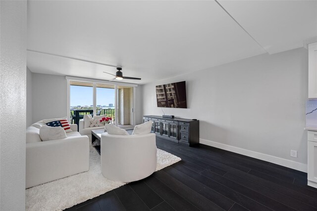100 Oakmont Ln Unit 802, Belleair, FL 33756 - living room featuring dark wood-style flooring, baseboards, and ceiling fan