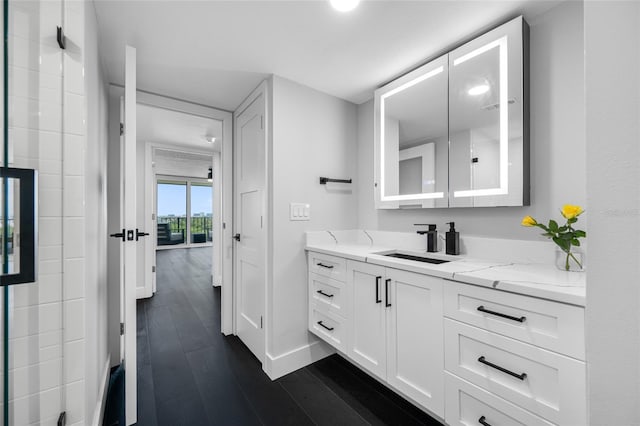 100 Oakmont Ln Unit 802, Belleair, FL 33756 - bathroom with vanity, baseboards, and wood finished floors