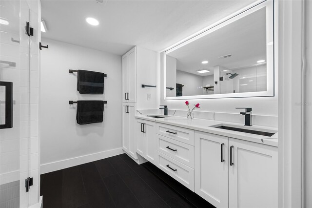 100 Oakmont Ln Unit 802, Belleair, FL 33756 - full bathroom featuring double vanity, a stall shower, baseboards, and recessed lighting