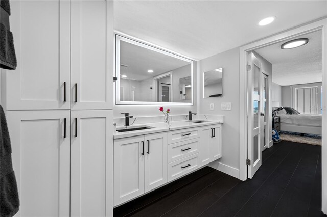 100 Oakmont Ln Unit 802, Belleair, FL 33756 - full bathroom featuring ensuite bathroom, baseboards, double vanity, wood finished floors, and recessed lighting