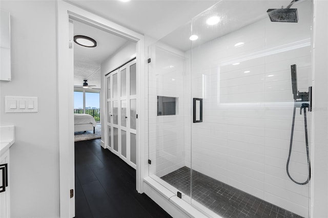 100 Oakmont Ln Unit 802, Belleair, FL 33756 - ensuite bathroom with a stall shower, wood-type flooring, vanity, and recessed lighting