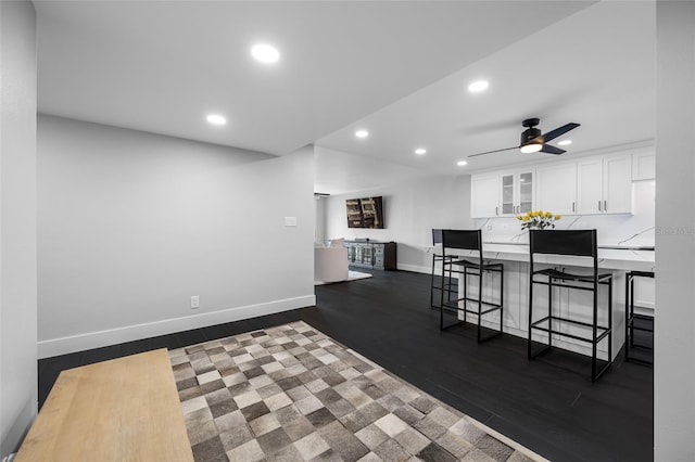 100 Oakmont Ln Unit 802, Belleair, FL 33756 - kitchen with recessed lighting, glass insert cabinets, white cabinetry, a breakfast bar area, and a ceiling fan