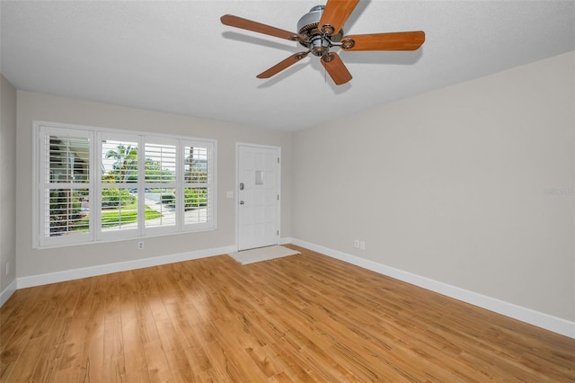 2073 Denmark St Unit 9, Clearwater, FL 33763 - foyer entrance featuring baseboards, light wood-style floors, and a ceiling fan