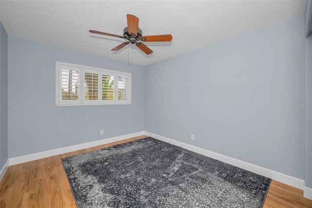 2073 Denmark St Unit 9, Clearwater, FL 33763 - unfurnished room with a ceiling fan, baseboards, and light wood finished floors