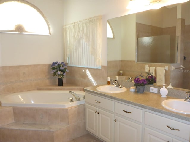 12271 Centralia Rd, Weeki Wachee, FL 34614 - full bath featuring a bath, double vanity, and a shower stall