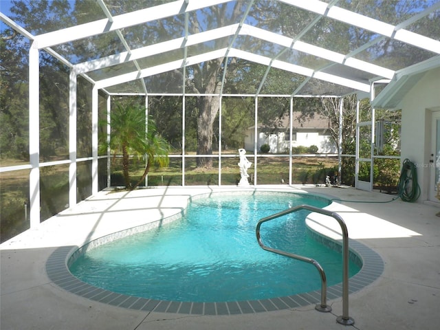 12271 Centralia Rd, Weeki Wachee, FL 34614 - swimming pool featuring a patio area and glass enclosure
