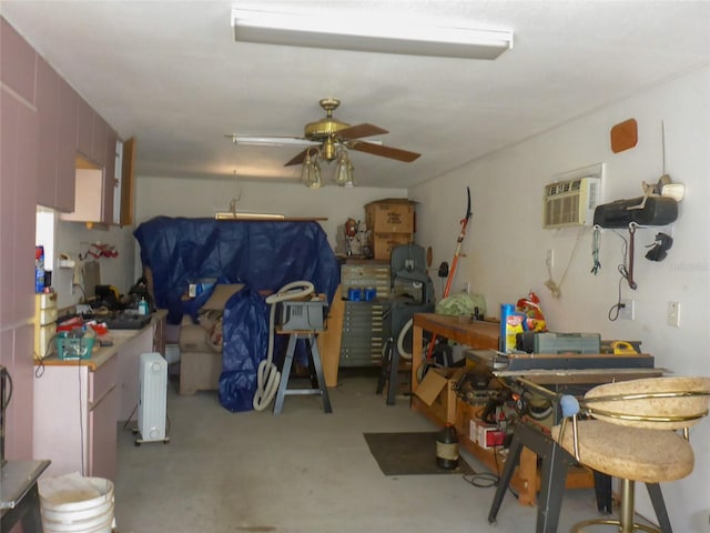 12271 Centralia Rd, Weeki Wachee, FL 34614 - misc room with ceiling fan, an AC wall unit, and concrete floors