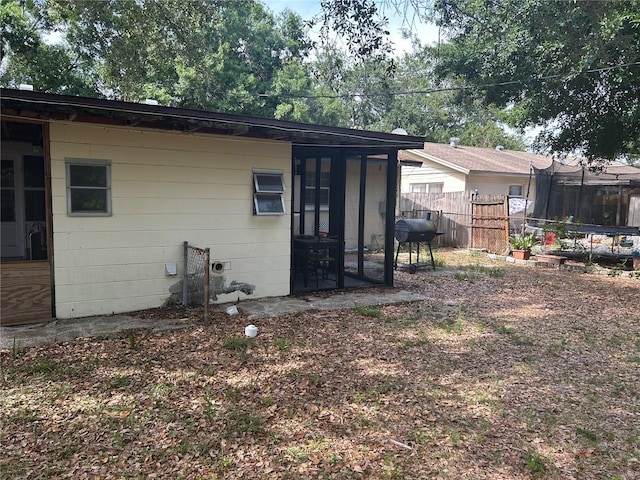 560 73rd Ave N, Saint Petersburg, FL 33702 - back of property with a trampoline