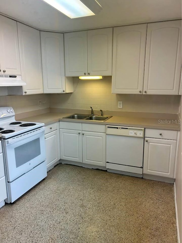 560 73rd Ave N, Saint Petersburg, FL 33702 - kitchen featuring white appliances, a sink, under cabinet range hood, and white cabinets