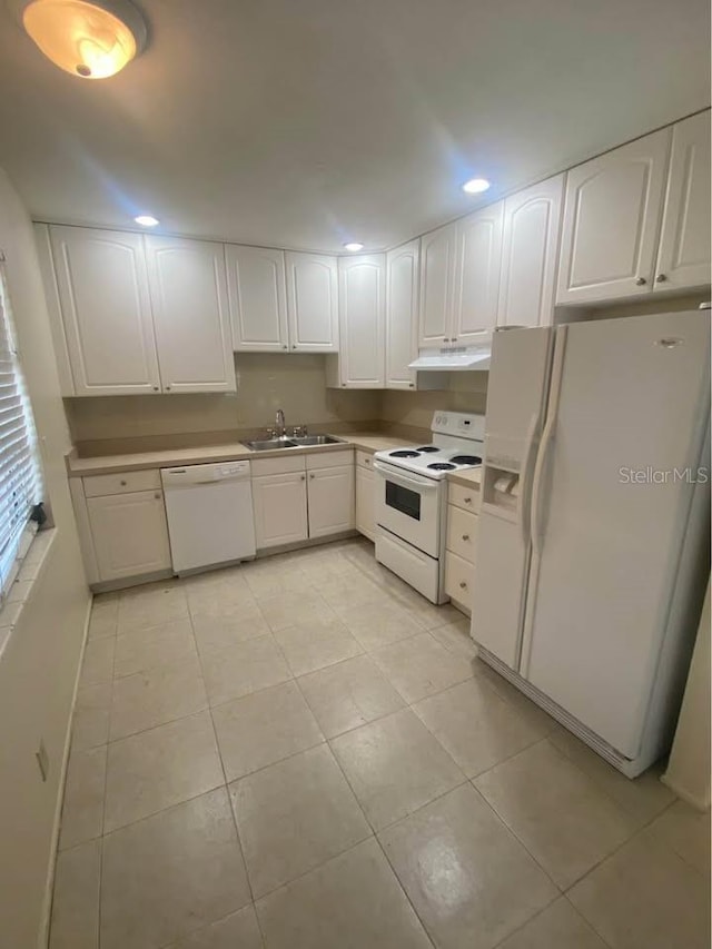 560 73rd Ave N, Saint Petersburg, FL 33702 - kitchen featuring white appliances, a sink, white cabinets, recessed lighting, and under cabinet range hood