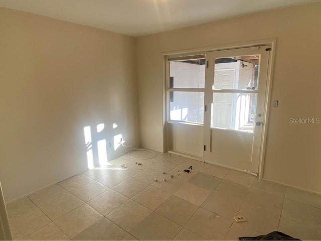 560 73rd Ave N, Saint Petersburg, FL 33702 - empty room featuring light tile patterned floors
