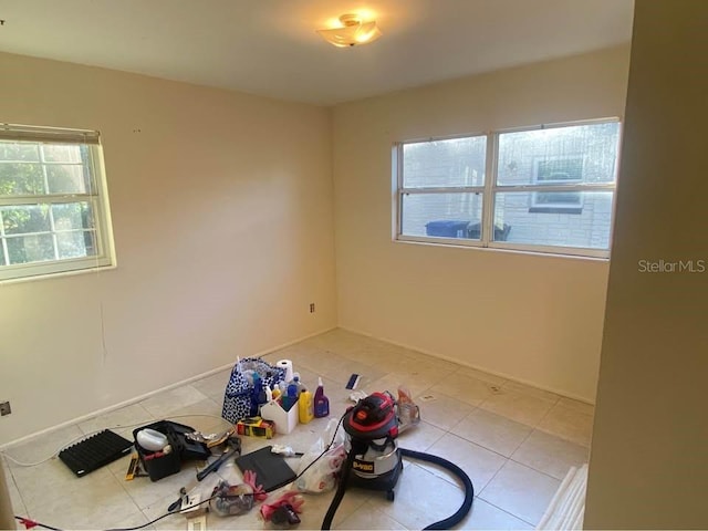 560 73rd Ave N, Saint Petersburg, FL 33702 - unfurnished room featuring light tile patterned floors and baseboards