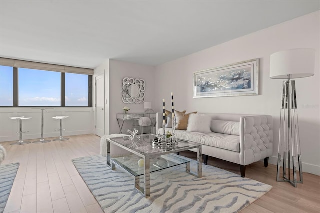 2620 Cove Cay Dr Unit 704, Clearwater, FL 33760 - living area featuring light wood-style floors and baseboards