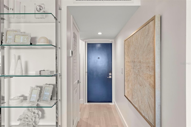 2620 Cove Cay Dr Unit 704, Clearwater, FL 33760 - entryway with wood finished floors, baseboards, and recessed lighting