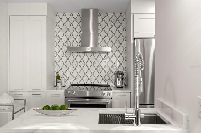 2620 Cove Cay Dr Unit 704, Clearwater, FL 33760 - kitchen featuring wall chimney exhaust hood, stainless steel electric range, tasteful backsplash, white cabinetry, and a sink
