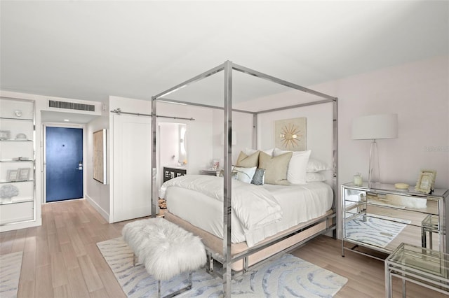 2620 Cove Cay Dr Unit 704, Clearwater, FL 33760 - bedroom with wood finished floors