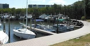 2620 Cove Cay Dr Unit 704, Clearwater, FL 33760 - dock area featuring a water view