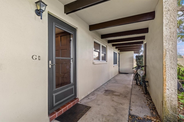 1701 Pinehurst Rd Unit 9G, Dunedin, FL 34698 - doorway to property with stucco siding