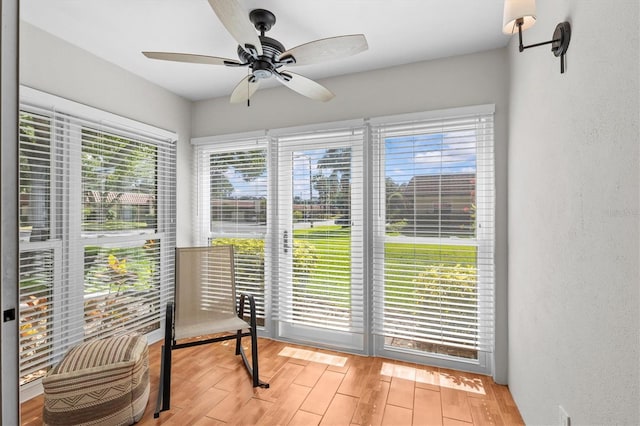 1701 Pinehurst Rd Unit 9G, Dunedin, FL 34698 - sunroom / solarium featuring wood finished floors and a textured wall