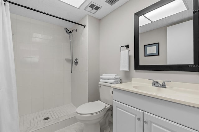 1701 Pinehurst Rd Unit 9G, Dunedin, FL 34698 - full bath with a tile shower, toilet, and vanity