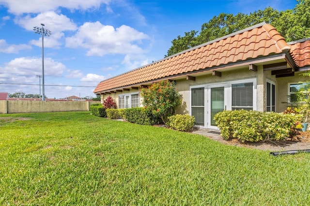 1701 Pinehurst Rd Unit 9G, Dunedin, FL 34698 - back of property featuring a tiled roof and stucco siding